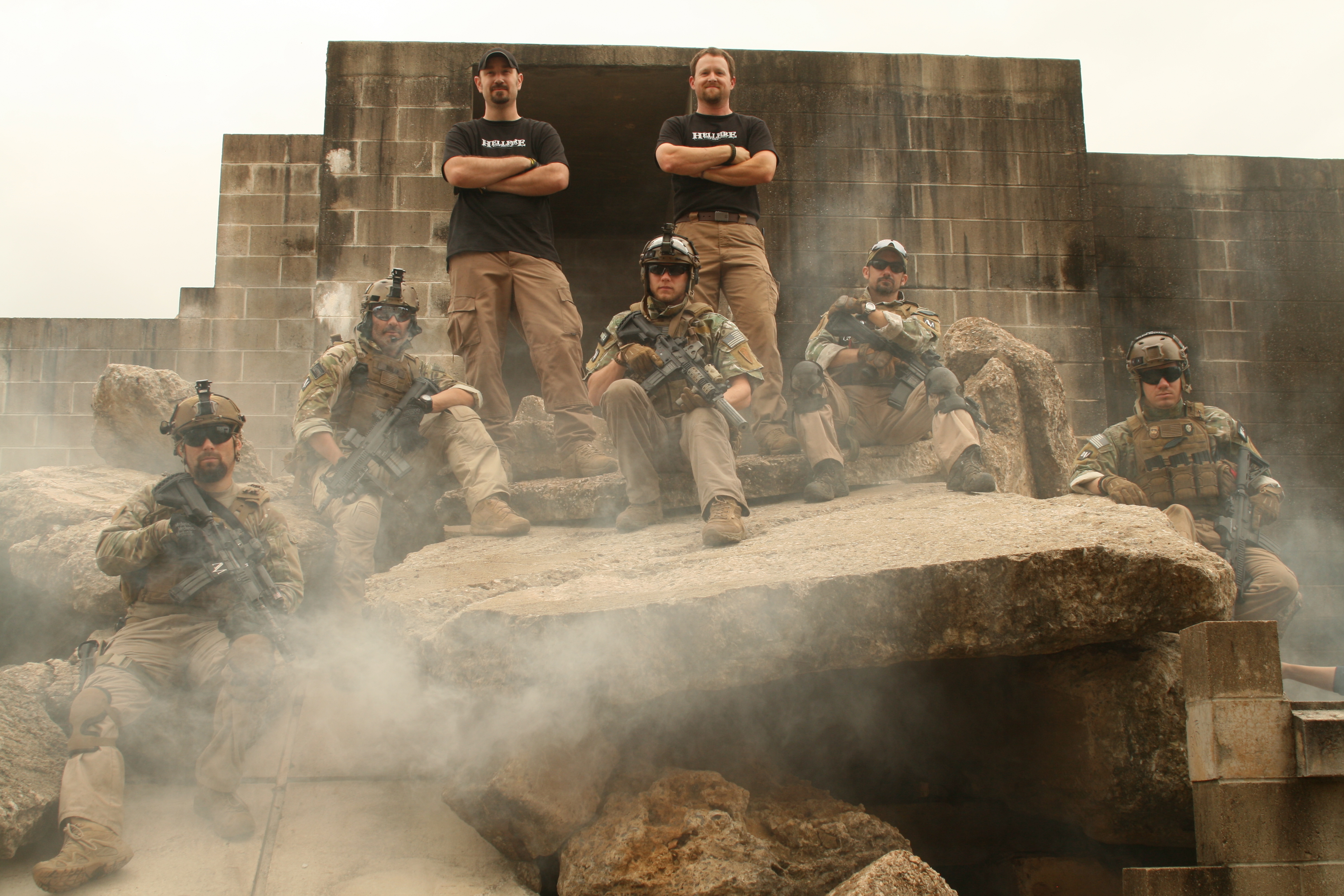Airsoft Team posed on the rubble of an sanctioned airsoft course
